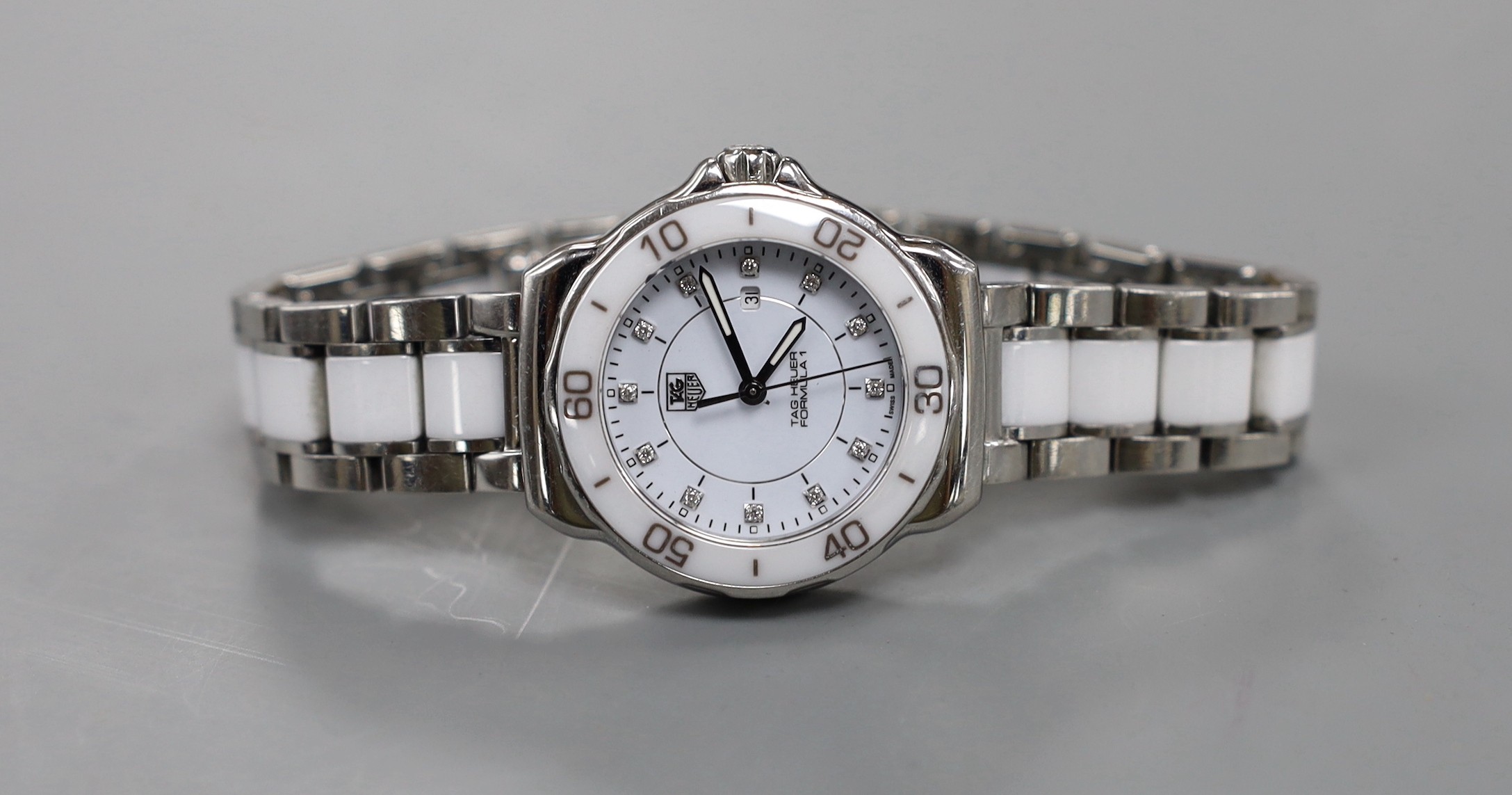 A lady's Tag Heuer Formula One quartz wristwatch (with box and receipt).